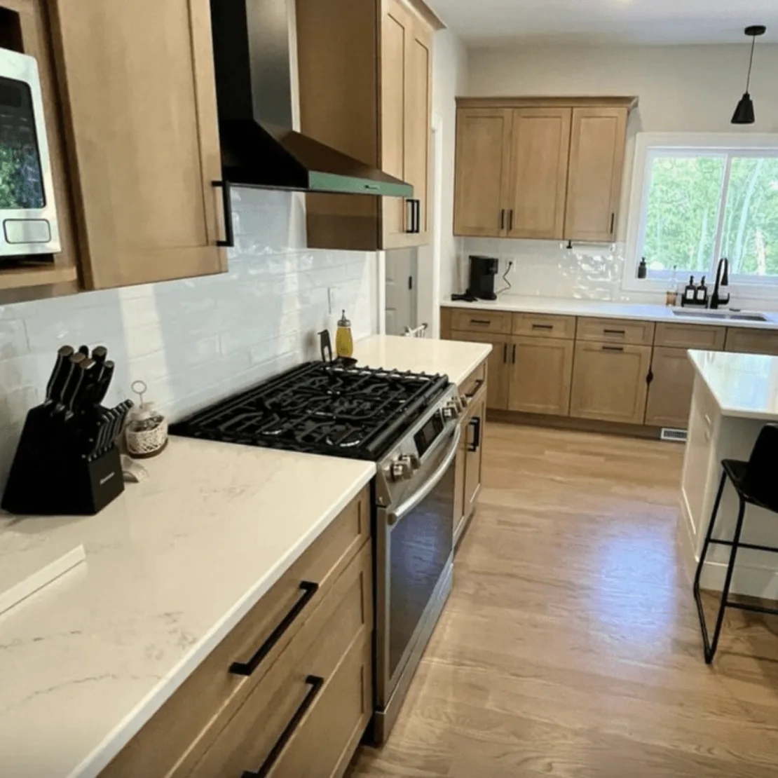 Alabaster Gold quartz counters in a natural wood kitchen