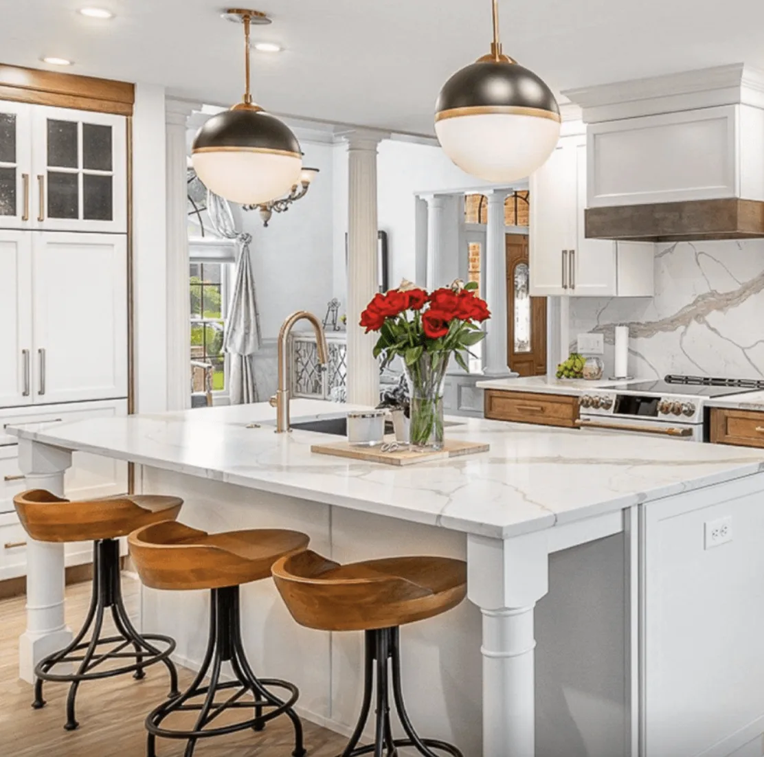 Calacatta Lavish quartz island with bar stools
