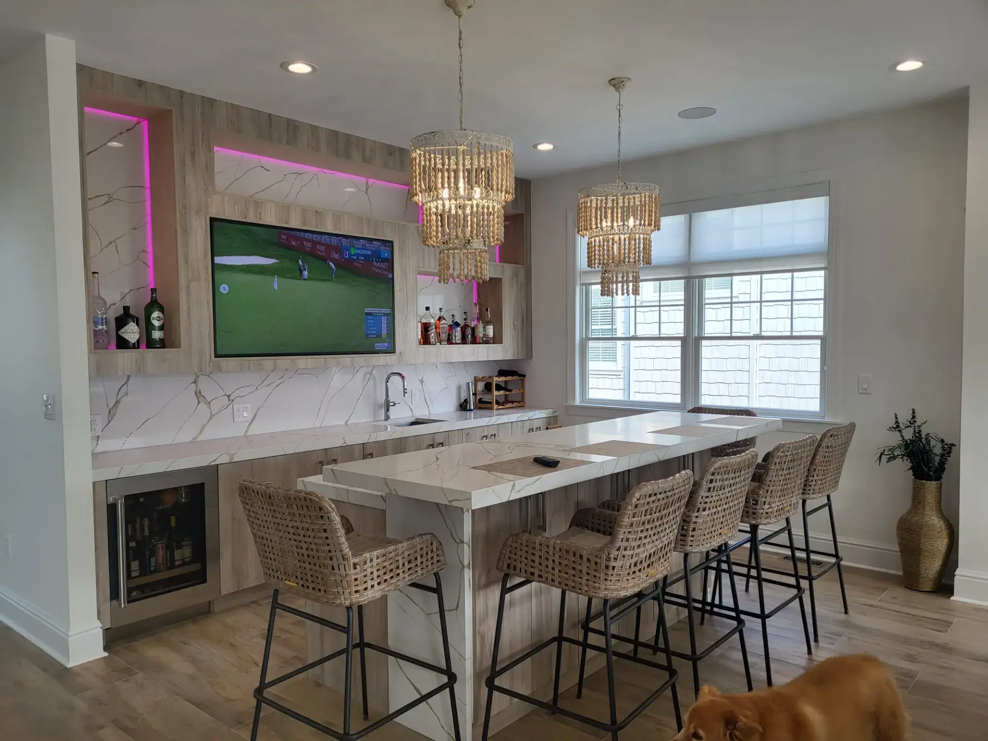 Bright kitchen with a stone island and seating for four