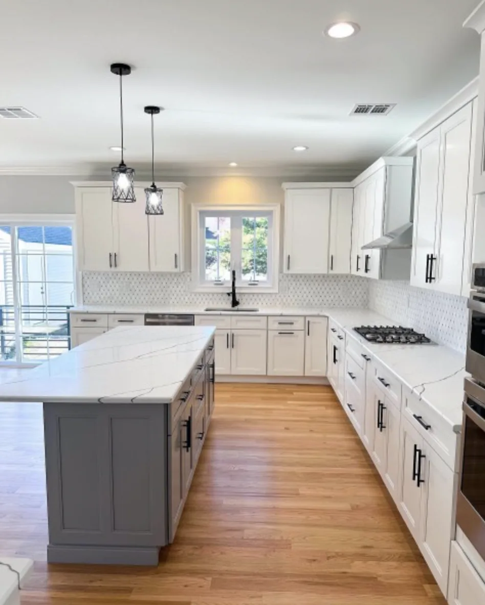 Porrino Grey quartz island in a white shaker kitchen